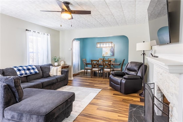 living room with hardwood / wood-style flooring and ceiling fan