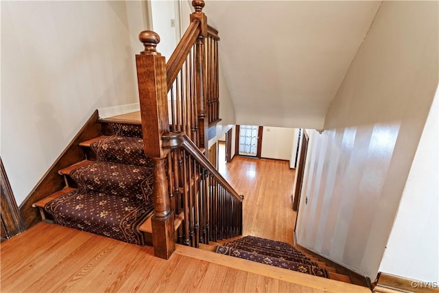 staircase with hardwood / wood-style flooring