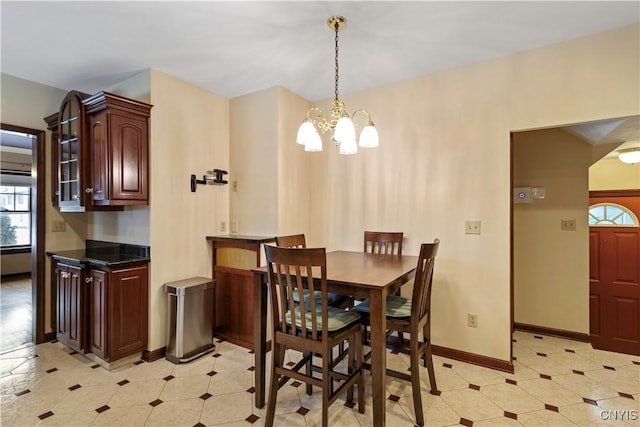 dining space with a notable chandelier