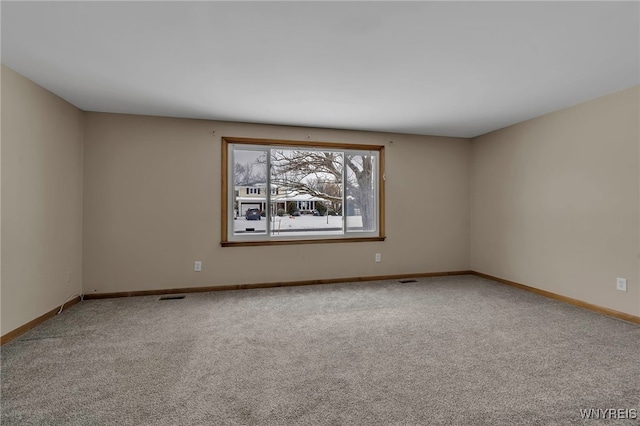 spare room with carpet floors