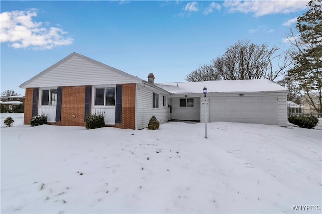 single story home featuring a garage