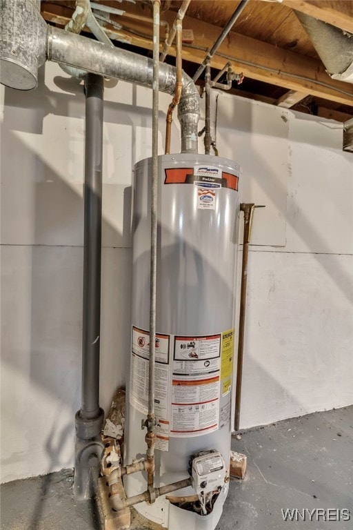 utility room featuring water heater