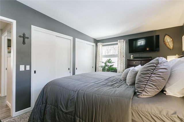 bedroom with two closets