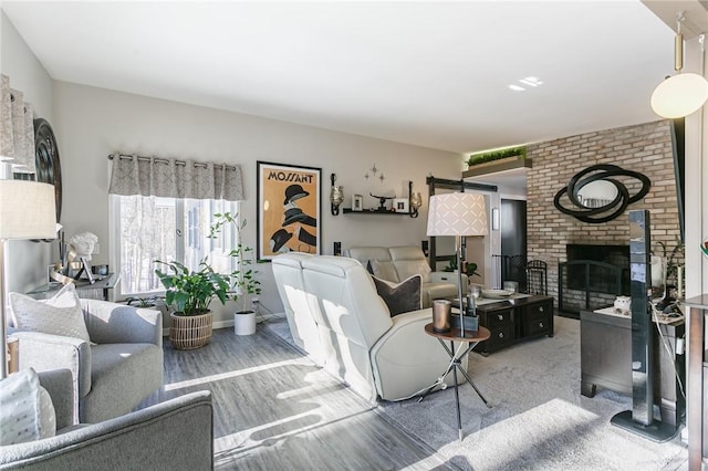 living room featuring a fireplace and hardwood / wood-style floors