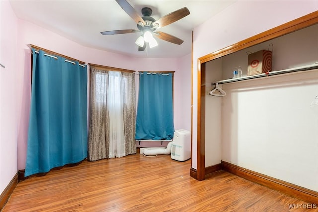 unfurnished bedroom with light hardwood / wood-style floors and ceiling fan