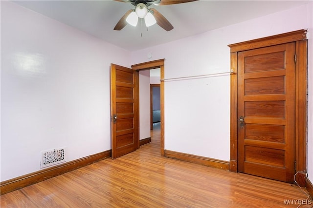 unfurnished bedroom featuring light hardwood / wood-style flooring and ceiling fan