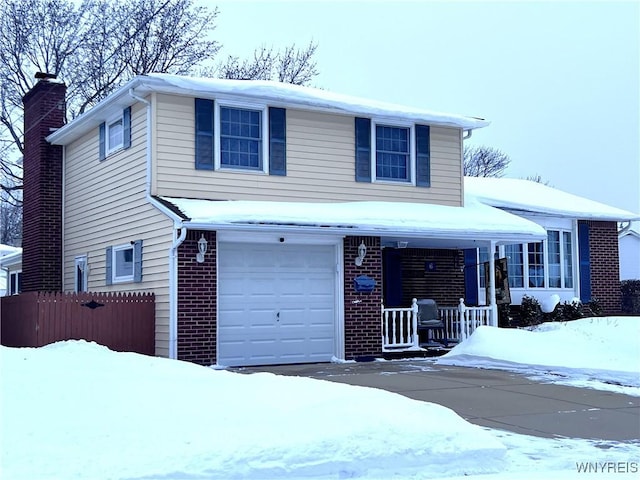 view of front of home with a porch and a garage