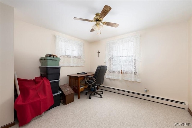 office with a baseboard radiator, ceiling fan, and carpet flooring