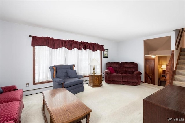 living room featuring baseboard heating and light carpet