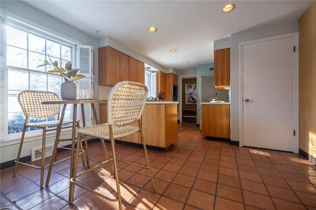 kitchen featuring dark tile patterned flooring