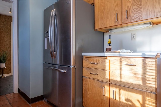 kitchen with tile patterned flooring and stainless steel refrigerator with ice dispenser