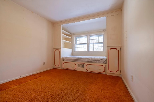 spare room featuring light carpet