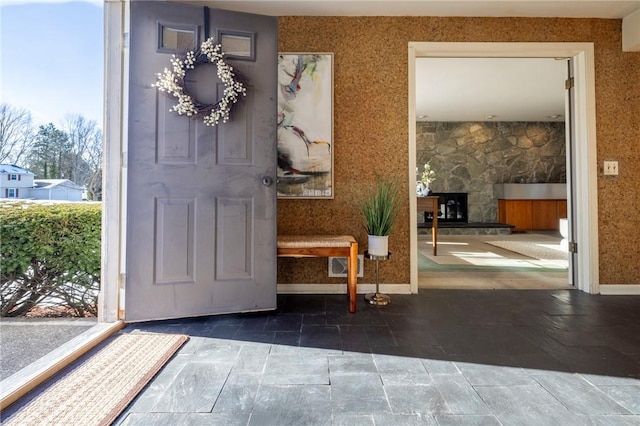 interior space featuring a stone fireplace