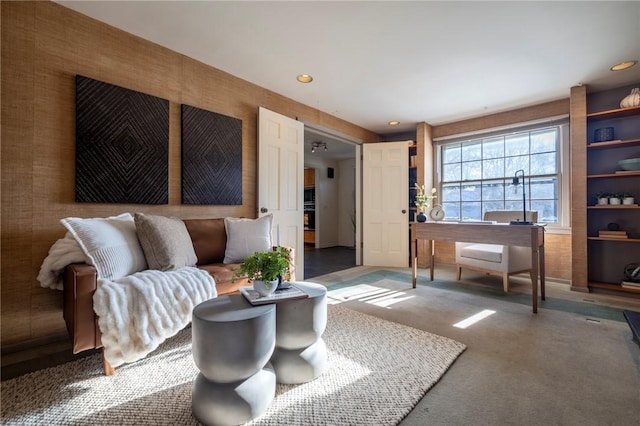 living room featuring dark colored carpet