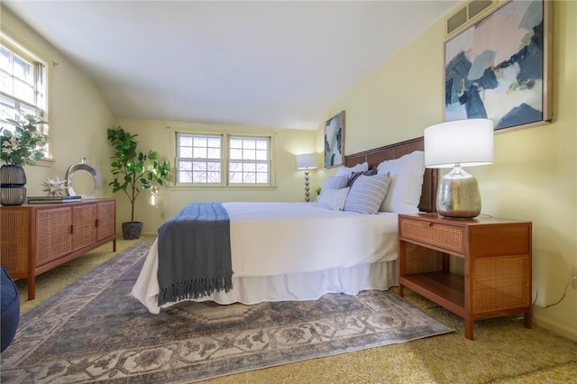 carpeted bedroom featuring vaulted ceiling