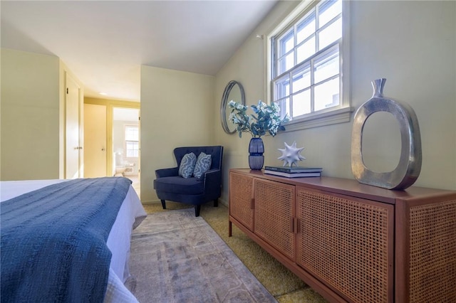 carpeted bedroom with ensuite bath