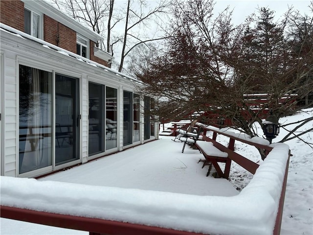 view of snow covered deck