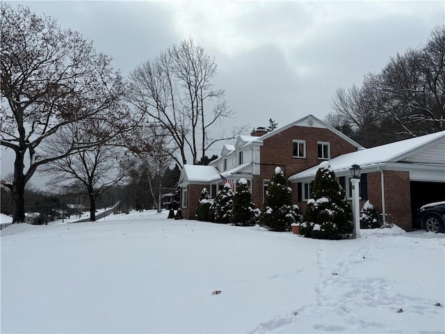 view of yard layered in snow