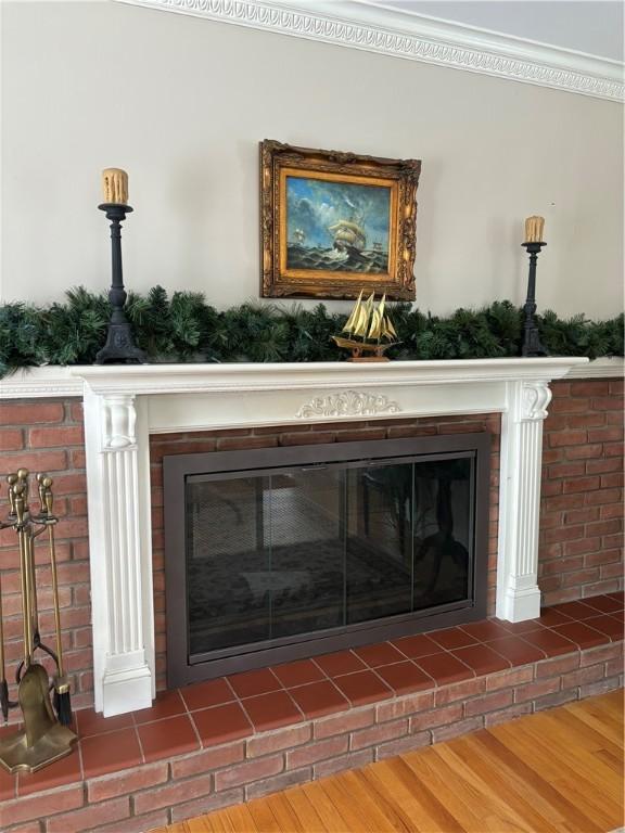 details with crown molding and wood-type flooring