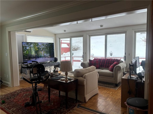 living room with parquet flooring and ornamental molding