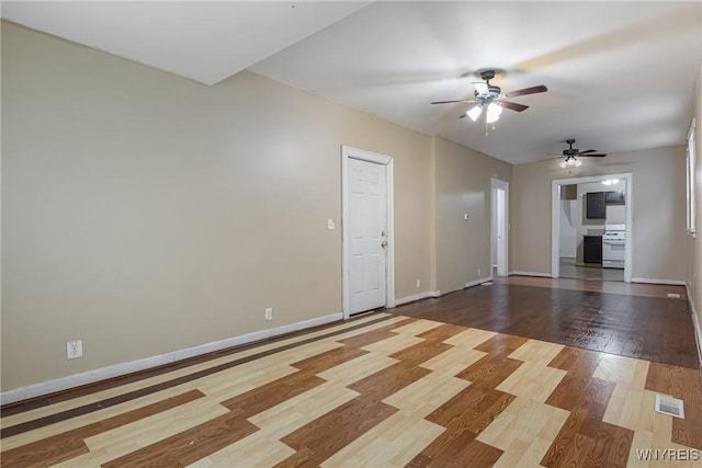 unfurnished living room with hardwood / wood-style floors and ceiling fan