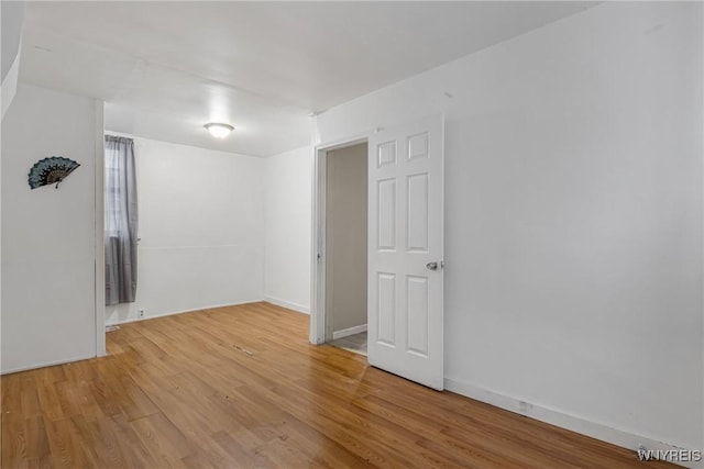 empty room with light wood-type flooring