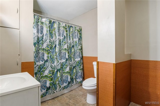 full bathroom featuring shower / tub combo, vanity, toilet, and tile patterned flooring