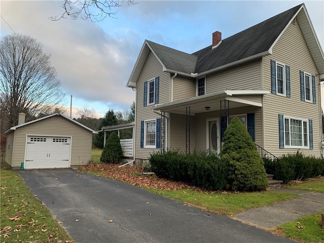 view of home's exterior with a garage and an outdoor structure