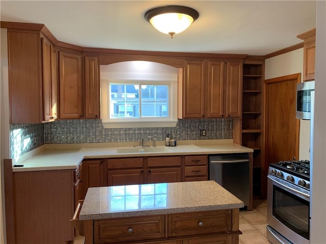 kitchen with sink, backsplash, stainless steel appliances, and light tile patterned floors