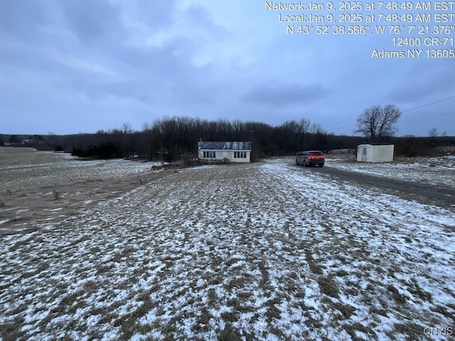 view of yard covered in snow