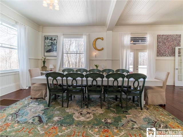 dining room with crown molding, wood-type flooring, french doors, and plenty of natural light