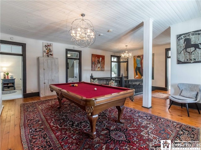 playroom featuring wood ceiling, a notable chandelier, hardwood / wood-style flooring, and billiards