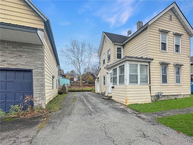 view of property exterior with a garage