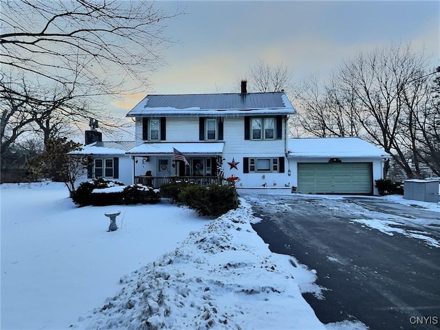 view of front of home featuring a garage and a porch