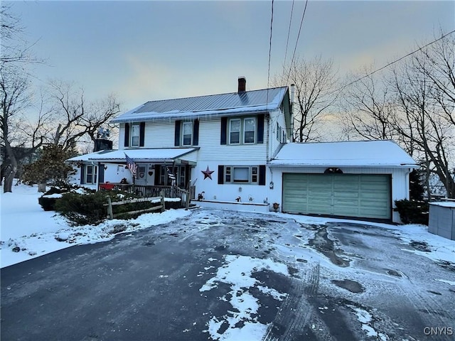 view of front of house with a porch and a garage