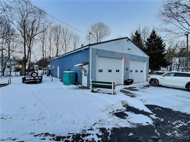 view of snow covered garage