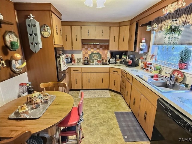 kitchen featuring sink, backsplash, and black appliances