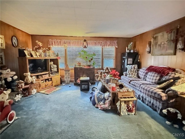 carpeted living room with wooden walls