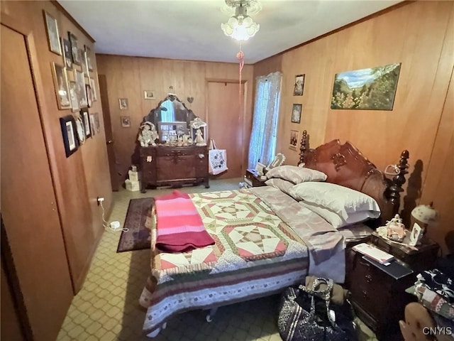 bedroom featuring wood walls