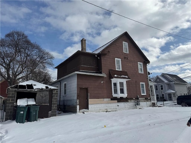 view of snow covered house