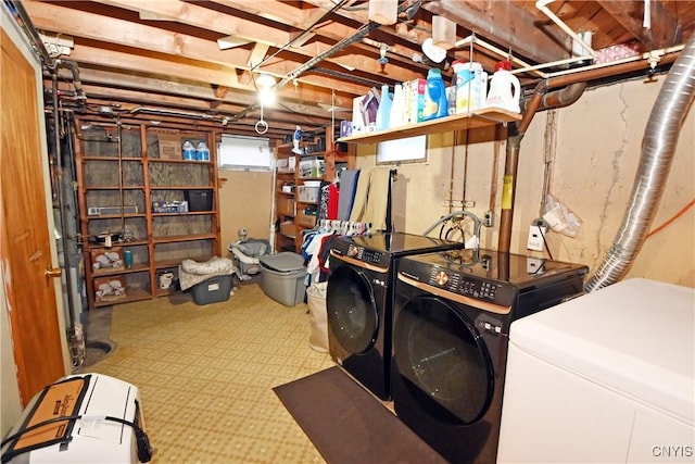 clothes washing area with independent washer and dryer