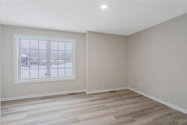 unfurnished room featuring light wood-type flooring