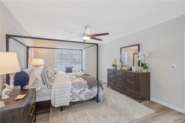 bedroom with hardwood / wood-style flooring and ceiling fan