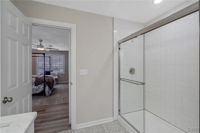 bathroom with wood-type flooring and walk in shower