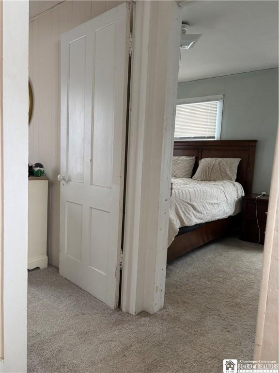 unfurnished bedroom featuring light colored carpet