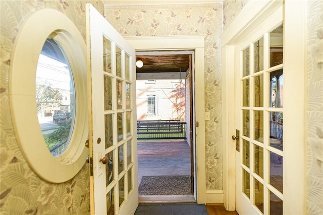 doorway with hardwood / wood-style flooring and french doors