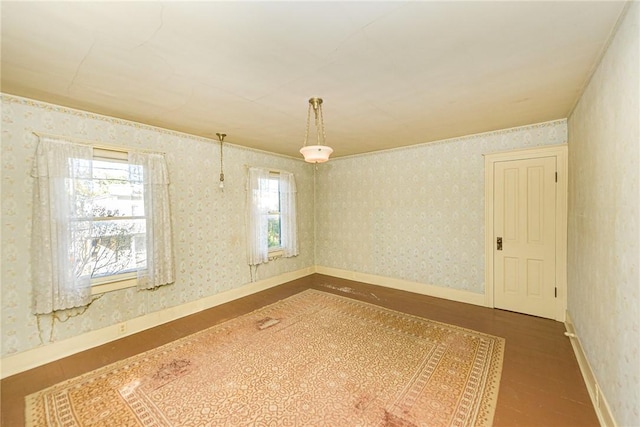 unfurnished room featuring wood-type flooring and plenty of natural light