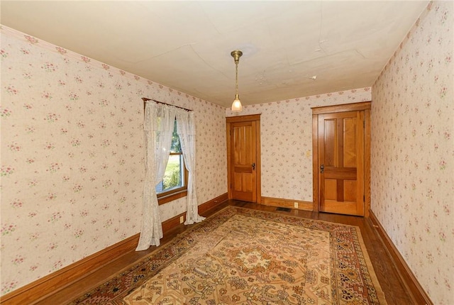 spare room with wood-type flooring