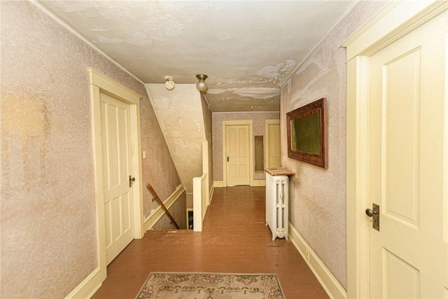 corridor with radiator and dark wood-type flooring