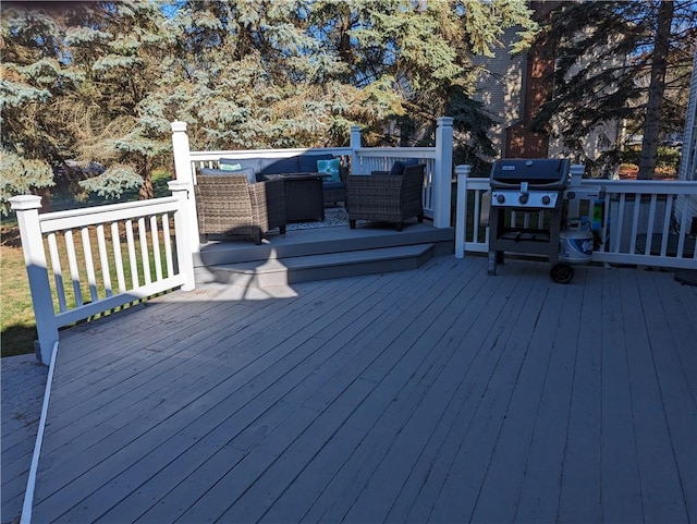 wooden deck with grilling area and outdoor lounge area